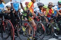 A group of boys dressed in cycling sports along with their bikes