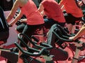 Group of Boys and Girls at Gym: Workout with Spinning Bikes Royalty Free Stock Photo