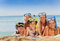 Group of boys and girls la on the sea beach Royalty Free Stock Photo