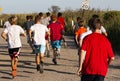 Group of boys running on dirt road by The Fire Island Lighthouse