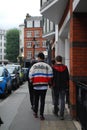 Group of boys walking down the street in London Covent Garden