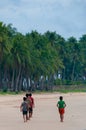 Group of Boys Walking at The sand Beach in front o