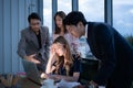 Group of broker international stock traders working actively at night in office, Royalty Free Stock Photo