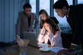 Group of broker international stock traders working actively at night in office, Royalty Free Stock Photo