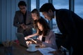 Group of broker international stock traders working actively at night in office, Royalty Free Stock Photo