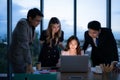 Group of broker international stock traders working actively at night in office, Royalty Free Stock Photo