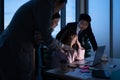 Group of broker international stock traders working actively at night in office, Royalty Free Stock Photo