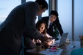 Group of broker international stock traders working actively at night in office, Royalty Free Stock Photo