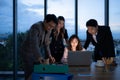 Group of broker international stock traders working actively at night in office, Royalty Free Stock Photo