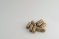 Group of brown herbal capsule - alternative medicine treatment pill Royalty Free Stock Photo