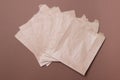 Group of brown recycle paper food bags on brown background. eco-friendly. top view. close-up Royalty Free Stock Photo