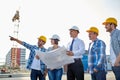 Group of builders and architects with blueprint Royalty Free Stock Photo