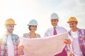 Group of builders and architects with blueprint Royalty Free Stock Photo