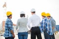 Group of builders and architects at building site Royalty Free Stock Photo