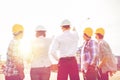 Group of builders and architects at building site Royalty Free Stock Photo