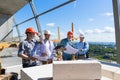 Group Of Builders On Construction Site Building Team Of Apprentices Meeting With Contractor Review Project Plan Royalty Free Stock Photo