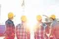 Group of builders in hardhats at construction site Royalty Free Stock Photo