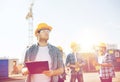 Group of builders in hardhats outdoors