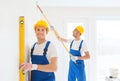 Group of builders with tools indoors Royalty Free Stock Photo