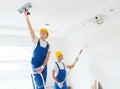 Group of builders with tools indoors Royalty Free Stock Photo