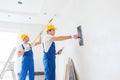 Group of builders with tools indoors Royalty Free Stock Photo