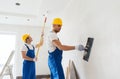 Group of builders with tools indoors Royalty Free Stock Photo