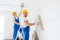 Group of builders with tools indoors Royalty Free Stock Photo