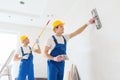 Group of builders with tools indoors Royalty Free Stock Photo