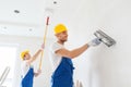 Group of builders with tools indoors Royalty Free Stock Photo