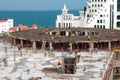 Group of building workers in hard hats working on construction site near the blac sea coast Royalty Free Stock Photo