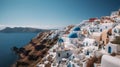 a group of buildings sitting on the top of a cliff next to the ocean