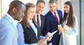 Group of buisness people working on tablet. Royalty Free Stock Photo