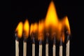 Group of burn and unburned matches, isolated on black background Royalty Free Stock Photo