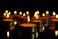 Group of burning candles on black background Royalty Free Stock Photo