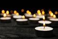 Group of burning candles on black background Royalty Free Stock Photo