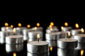 Group of burning candles on black background Royalty Free Stock Photo