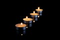 Group of burning candles on black background with reflection Royalty Free Stock Photo