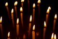 Group of burning candles in dark