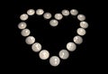 Group of burning candles forming a heart on black isolated background. Concept for St. Valentine Royalty Free Stock Photo