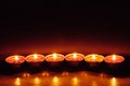 Group of burning red tealight candles Royalty Free Stock Photo