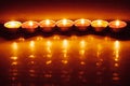 Group of burning red tealight candles