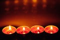 Group of burning red tealight candles Royalty Free Stock Photo