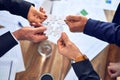 Group of business hands trying to connect puzzle pieces at office Royalty Free Stock Photo