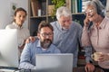 Group of business men and women working and communicating together in creative office - conference in video call