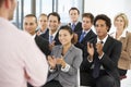 Group Of Business People Applauding Speaker At The End Of A Presentation Royalty Free Stock Photo