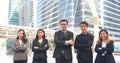 Group of business people asian team partners walking in city happy together. Leader executive men standing at modern urban city Royalty Free Stock Photo