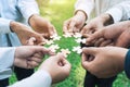 group of business people assembling jigsaw puzzle. The concept of cooperation, teamwork, help and support in business Royalty Free Stock Photo