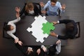 Business people assembling puzzle Royalty Free Stock Photo