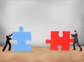 Business People Joining Puzzle Pieces On Desk Royalty Free Stock Photo