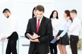 Group of business people with businessman leader on foreground